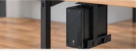 Black CPU holder suspended under a desk