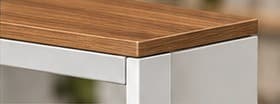 Urban Teak finish shown on a desk edge